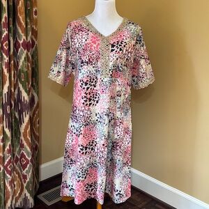 Floral V-Neck Dress with Gold Accents
Dress has pockets.